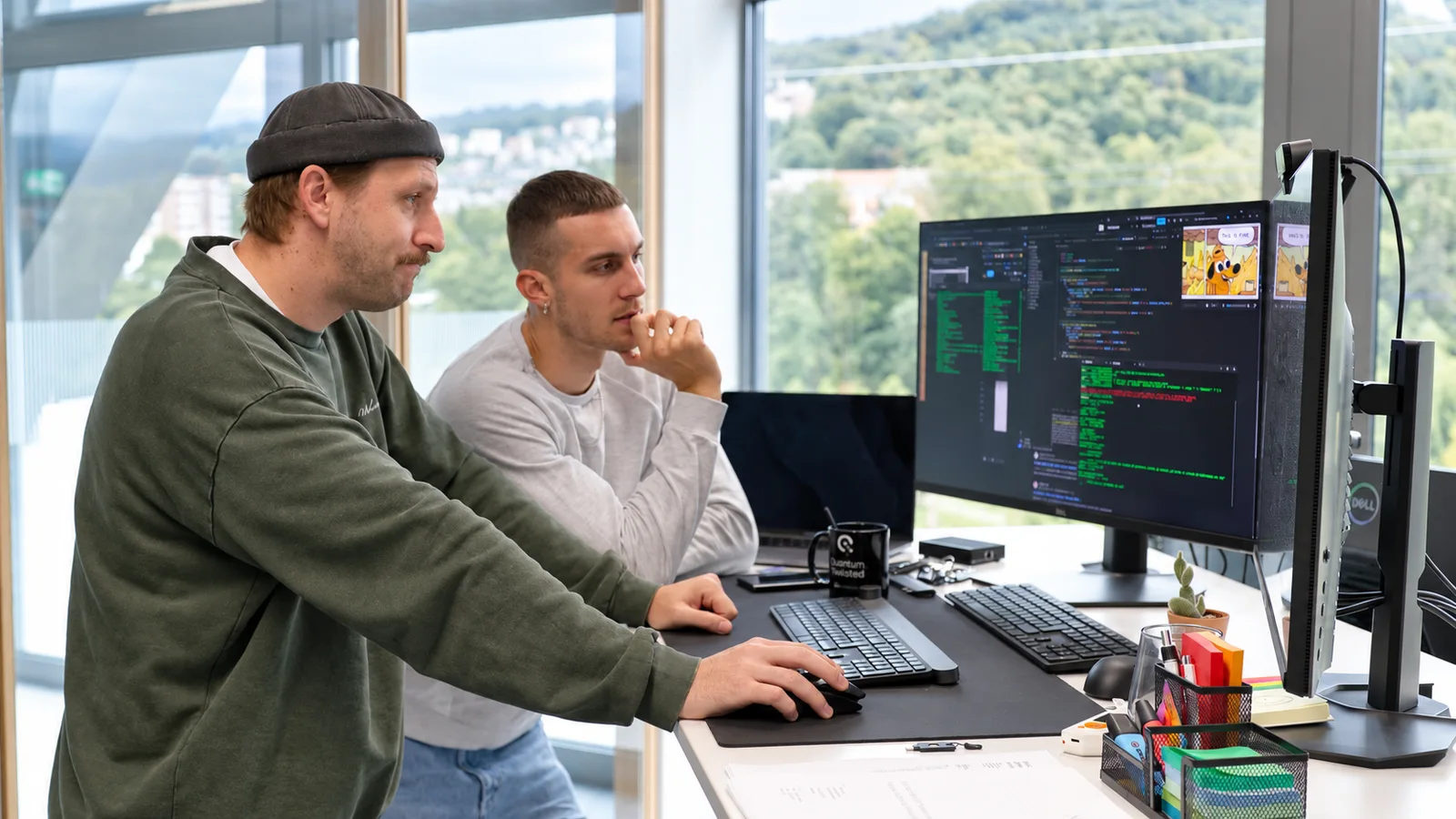 XAN team supporting a user at a workstation.